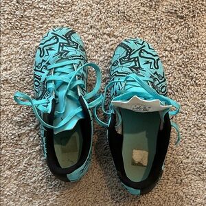 Puma Aqua and Black cleats